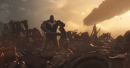 Iron Man (Tony Stark) fighting Thanos on Titan