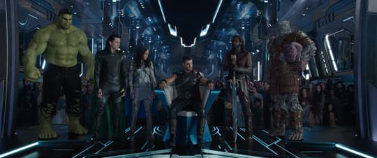 Valkyrie, Thor and the Asgardians flying away on the Statesman ship to safety