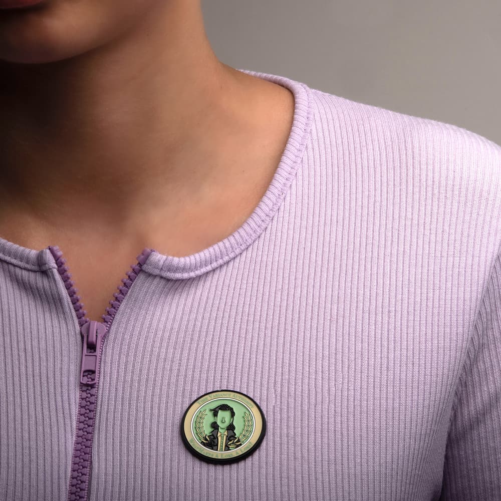 Loki TVA Pin / shop it <a href=    https://www.boxlunch.com/product/marvel-loki-time-variance-authority-enamel-pin/15228647.html>here</a>