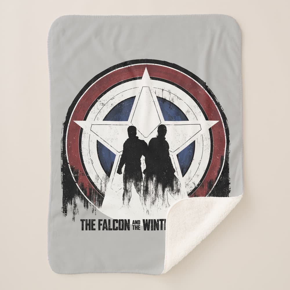 <a href=https://www.zazzle.com/falcon_winter_soldier_shield_silhouettes_sherpa_blanket-256181214639196274>’The Falcon and The Winte Soldier’ Sherpa Blanket</a> / Zazzle