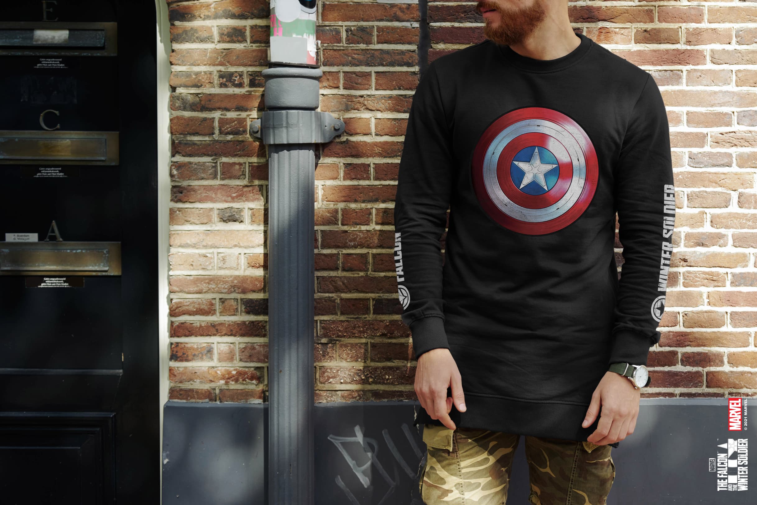 <a href=https://www.fye.com/marvel-falcon-and-the-winter-soldier-long-sleeve-t-shirt-pid.ckjamtvpu000l01lk7pt307qj.html?cgid=marvel-the_falcon_n_winter_soldier>’The Falcon and The Winter Soldier’ Long-Sleeve Shirt</a> / FYE