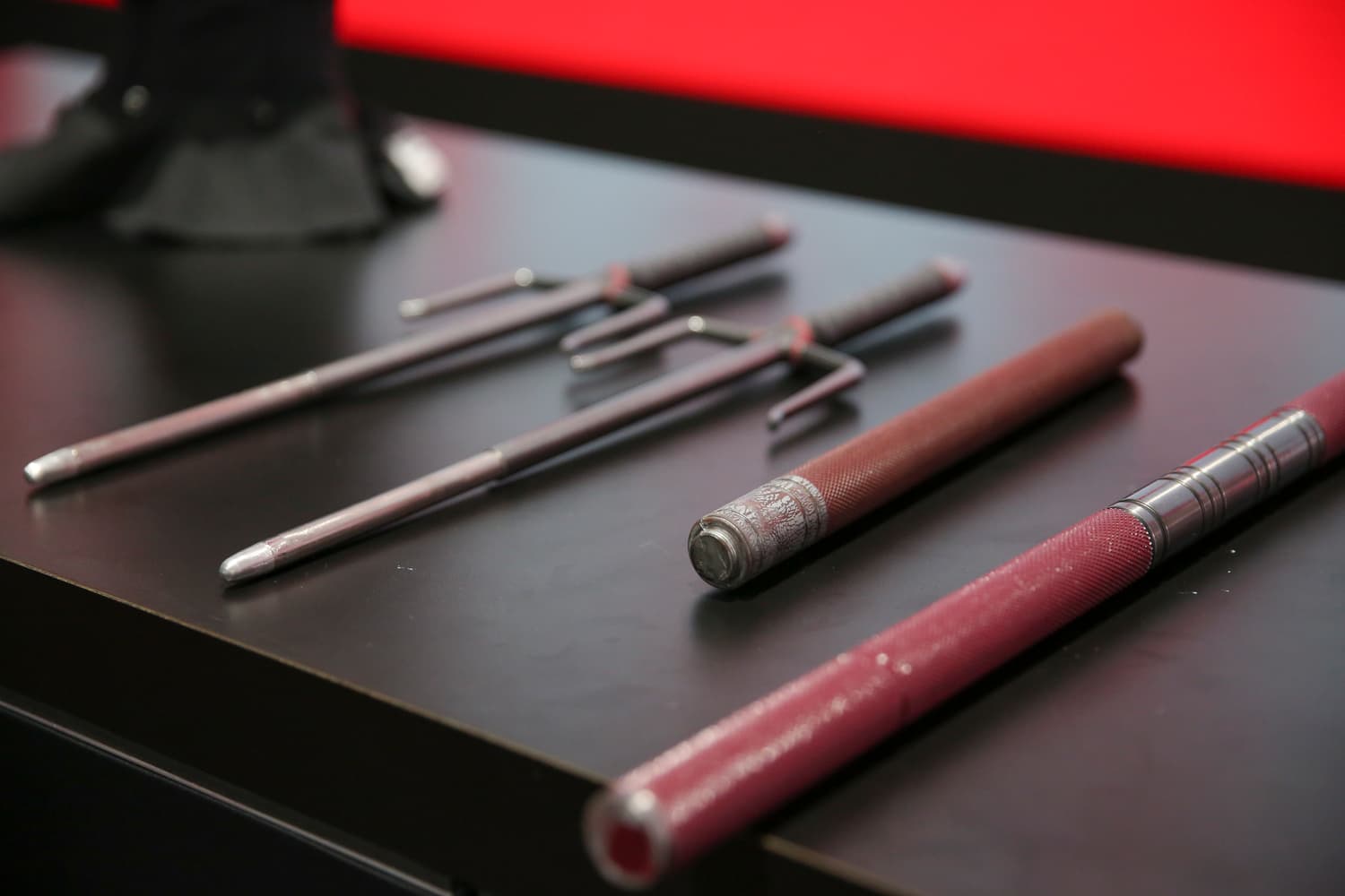 Elektra's sais and Daredevil's billy clubs from Marvel's Daredevil on display at the Marvel booth