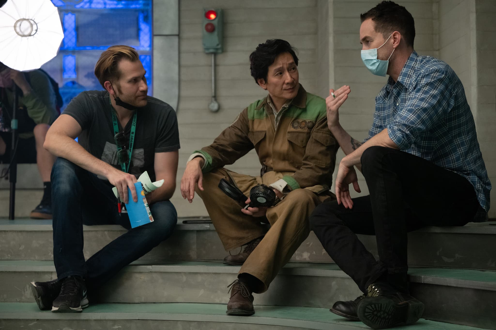 Ke Huy Quan listens to directors Aaron Moorhead and Justin Benson behind the scenes on 'Loki' Season 2