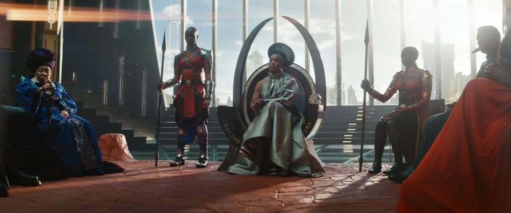 Queen Ramonda and the Dora Milaje in the Wakandan throne room in Marvel Studios' 'Black Panther: Wakanda Forever'