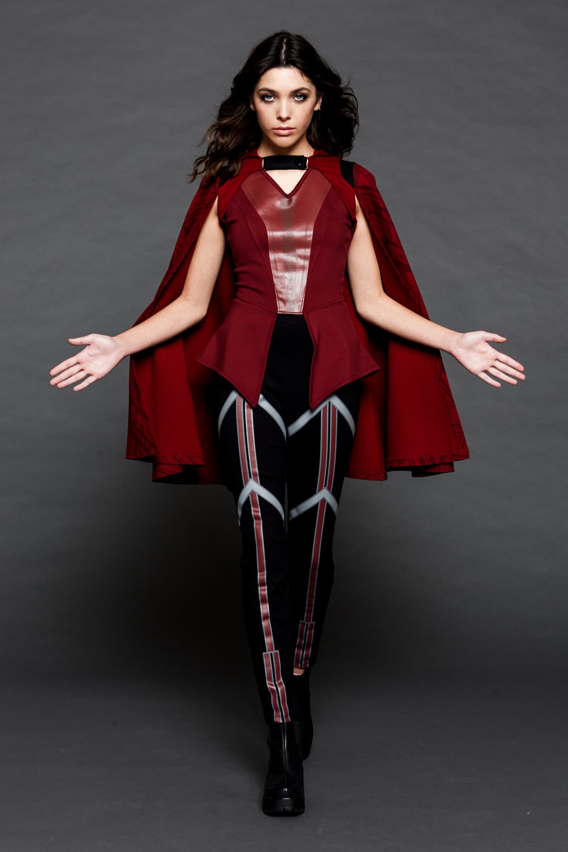 Her Universe Scarlet Witch <a href=https://www.hottopic.com/product/her-universe-marvel-wandavision-wanda-girls-peplum-top/14412437.html>top</a>, <a href=https://www.hottopic.com/product/her-universe-marvel-wandavision-wanda-high-waisted-leggings/14417111.html>leggings</a>, and <a href=https://www.hottopic.com/product/her-universe-marvel-wandavision-wanda-hooded-girls-cape/14806501.html>cape</a> / Hot Topic 