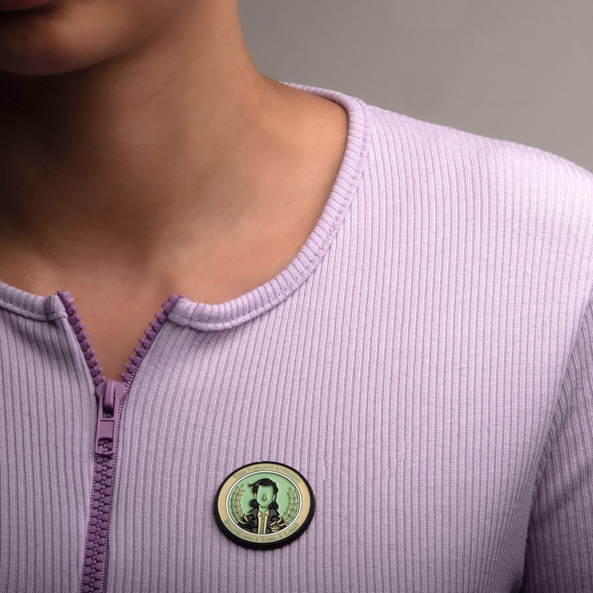 Loki TVA Pin / shop it <a href=    https://www.boxlunch.com/product/marvel-loki-time-variance-authority-enamel-pin/15228647.html>here</a>