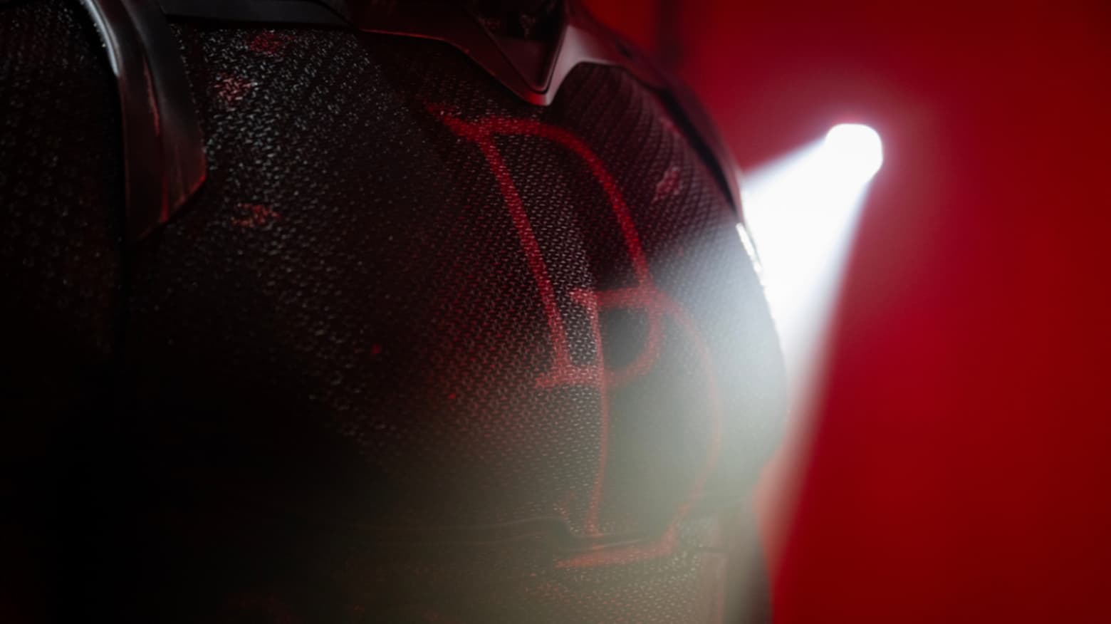 DD logo on the black suit
