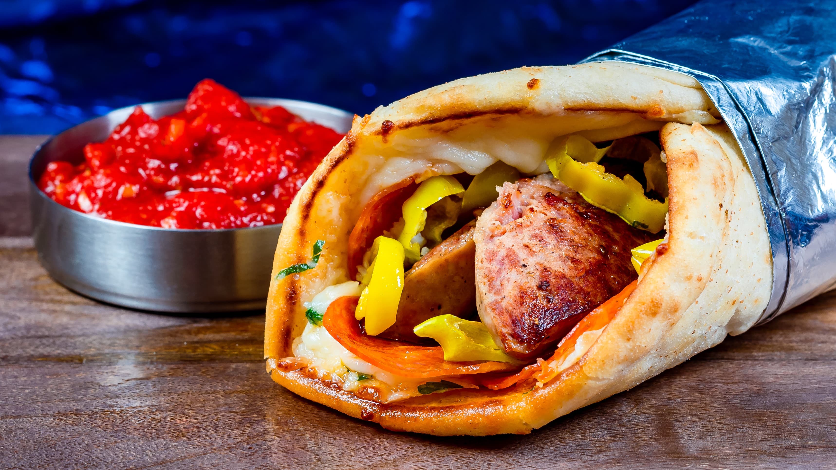 Sausage & Pepperoni Wrap at Shawarma Palace: Italian sausage, pepperoni, mozzarella, and pepperoncini in a garlic-parmesan wrap with marinara dipping sauce