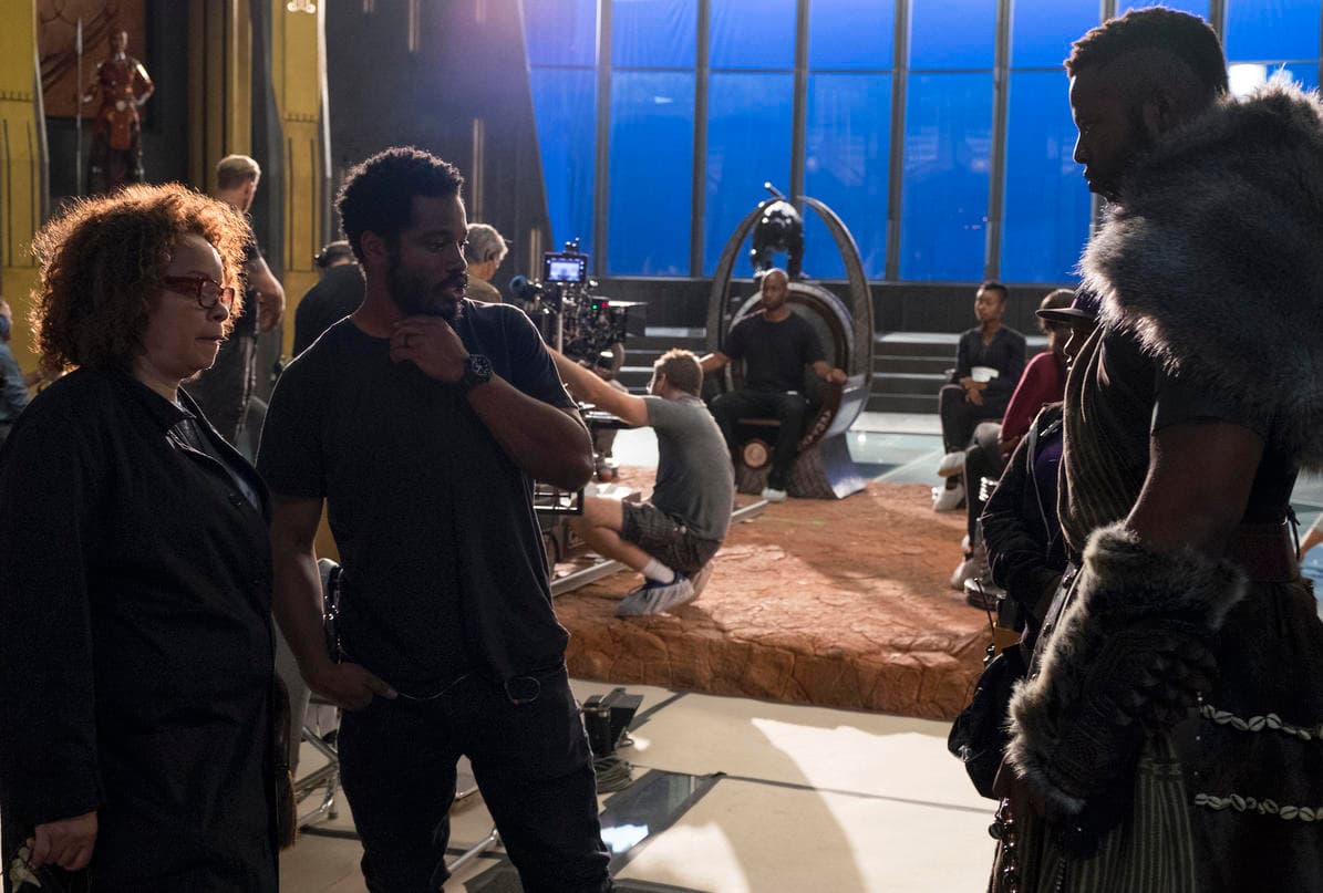 Costume Designer Ruth Carter and Director Ryan Coogler on set with Winston Duke (M’Baku)