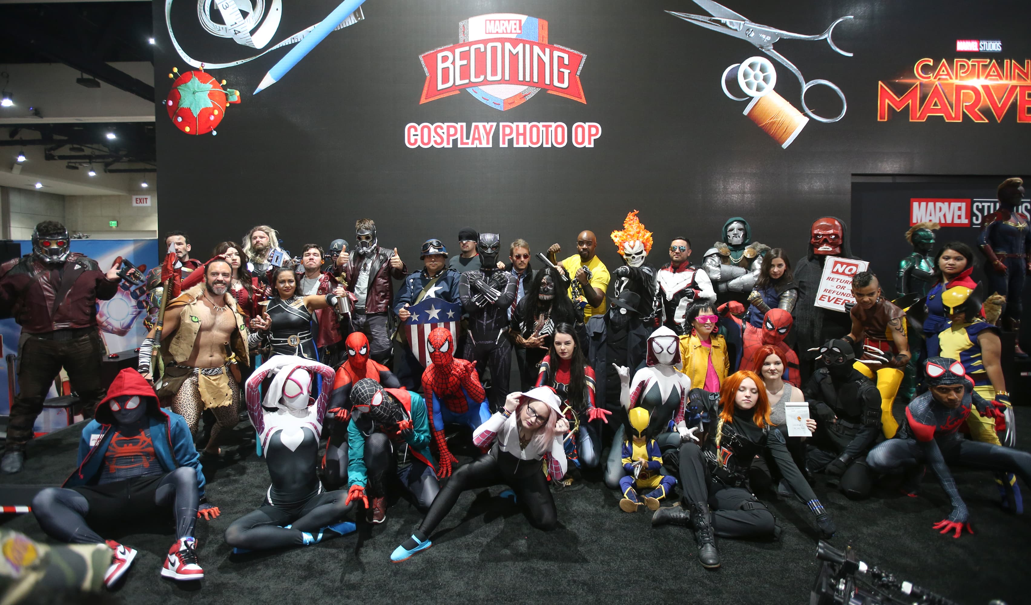 Marvel cosplayers gather at the Marvel booth for a Marvel Becoming cosplay meetup