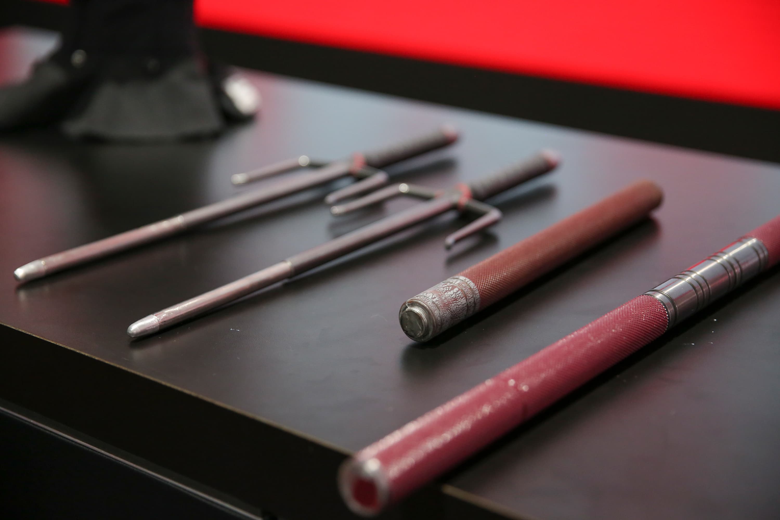Elektra's sais and Daredevil's billy clubs from Marvel's Daredevil on display at the Marvel booth