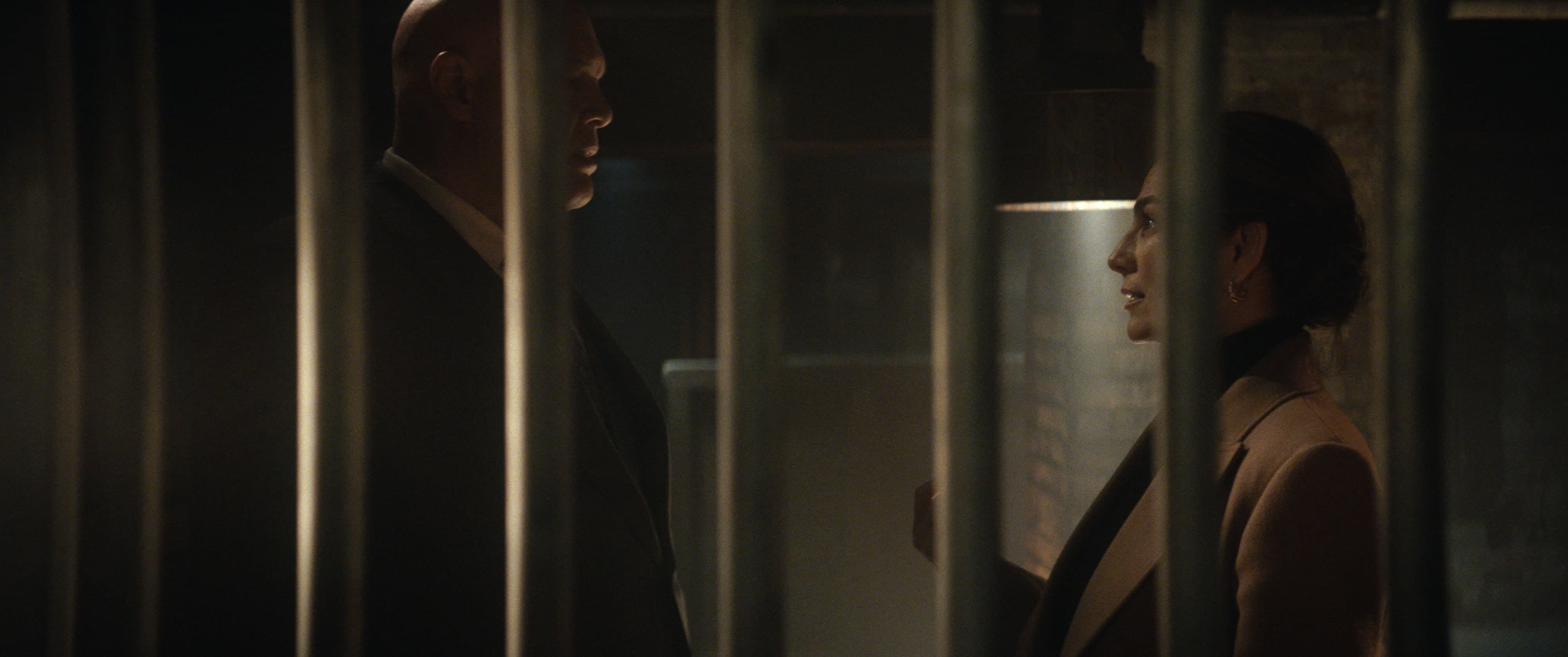 'Daredevil: Born Again' still of Wilson Fisk and Vanessa between the bars of a jail cell