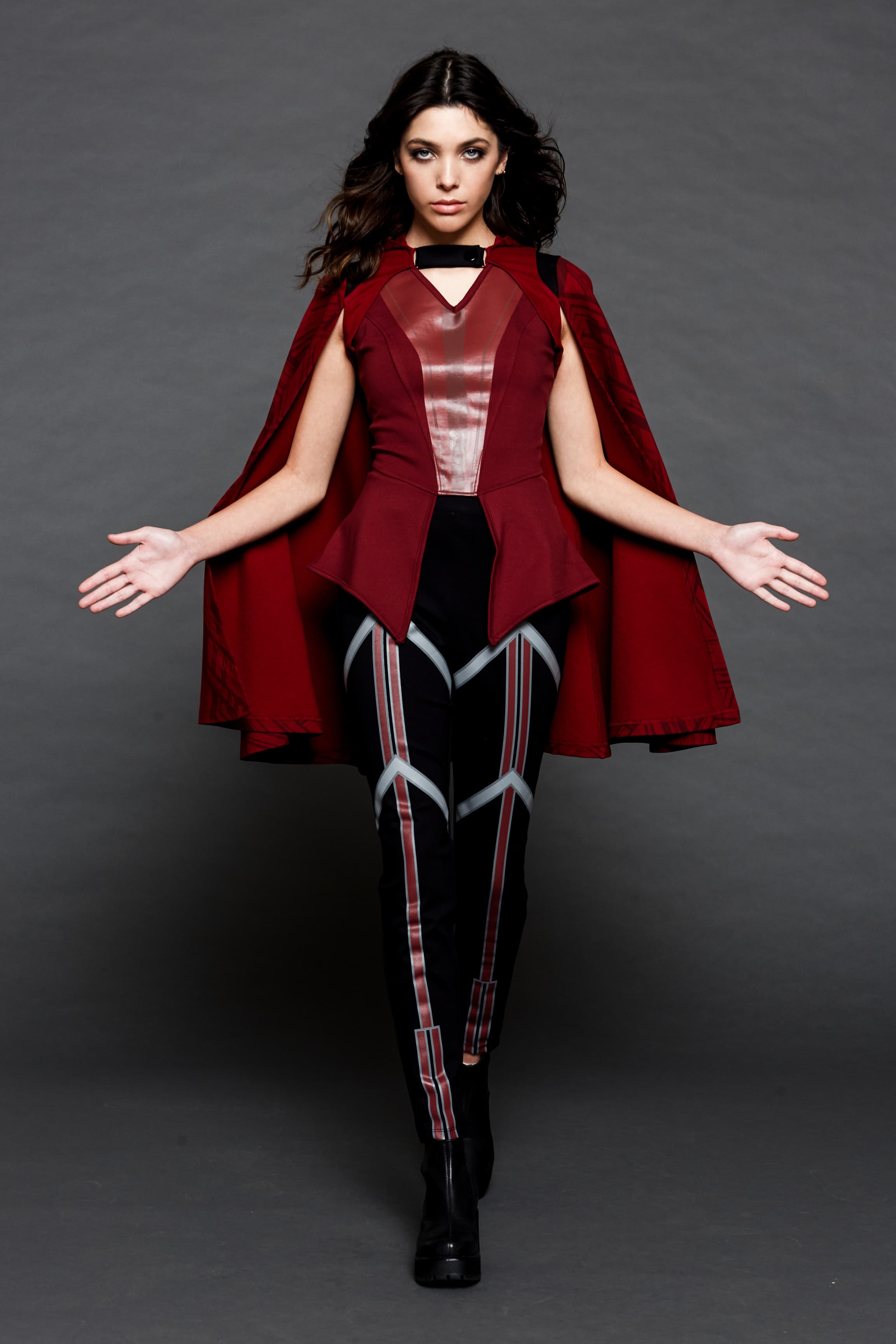 Her Universe Scarlet Witch <a href=https://www.hottopic.com/product/her-universe-marvel-wandavision-wanda-girls-peplum-top/14412437.html>top</a>, <a href=https://www.hottopic.com/product/her-universe-marvel-wandavision-wanda-high-waisted-leggings/14417111.html>leggings</a>, and <a href=https://www.hottopic.com/product/her-universe-marvel-wandavision-wanda-hooded-girls-cape/14806501.html>cape</a> / Hot Topic 
