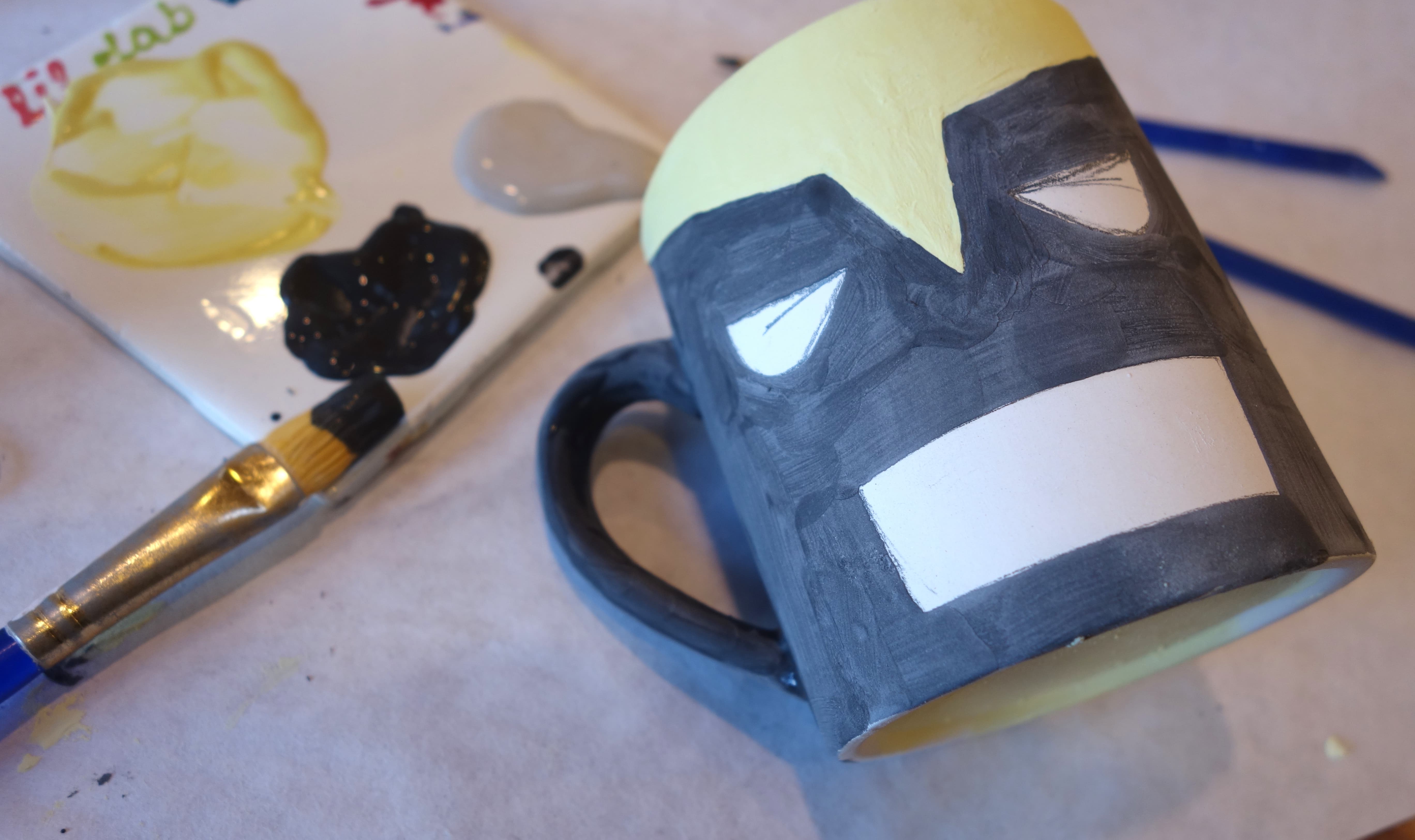 DIY Wolverine Mug - Paint in the black areas of Wolverine’s mask. 